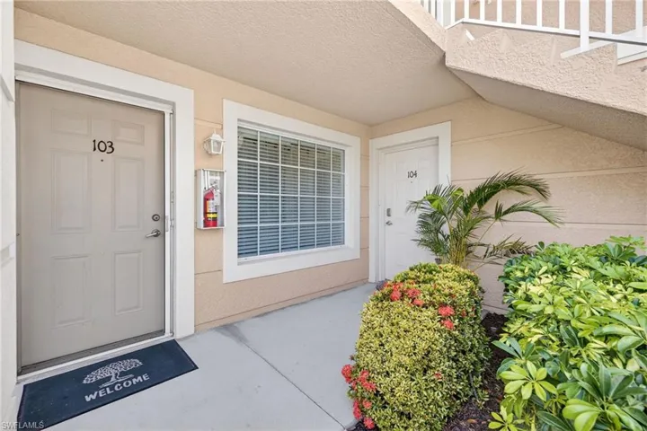 Property entrance with stucco siding