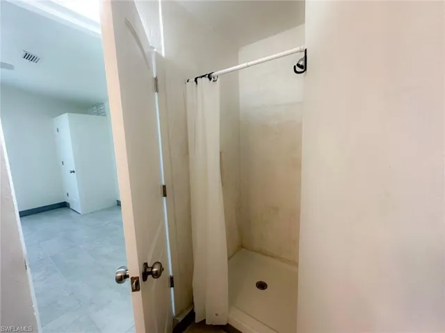 Bathroom featuring a shower stall