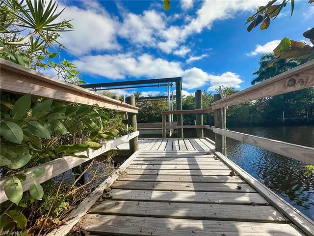 Dock featuring a deck with water view