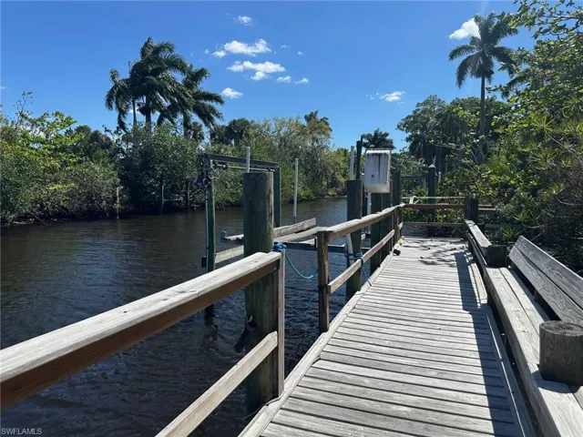 Dock area featuring a water view