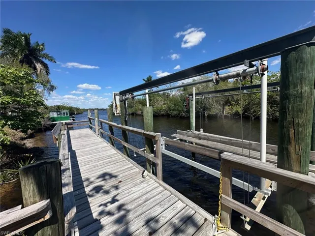 Dock featuring a water view and boat lift