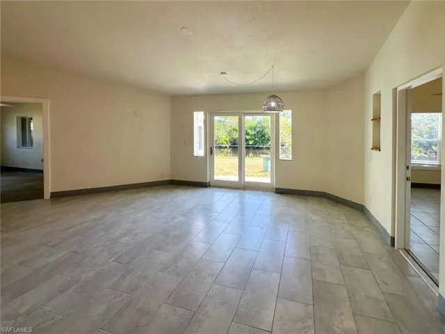 Spare room with healthy amount of natural light