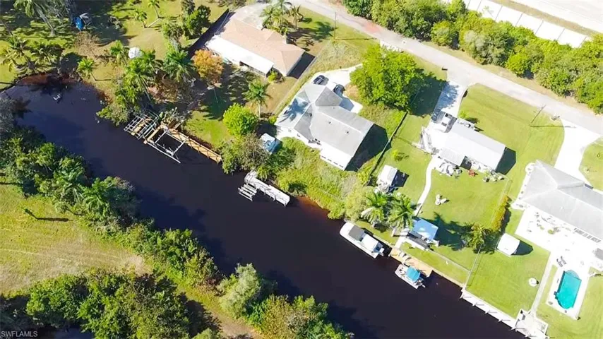 Aerial perspective of suburban area with a large body of water