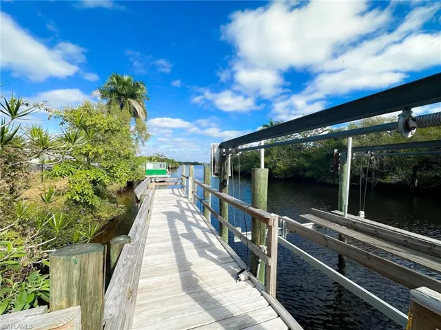 Dock featuring a water view and boat lift