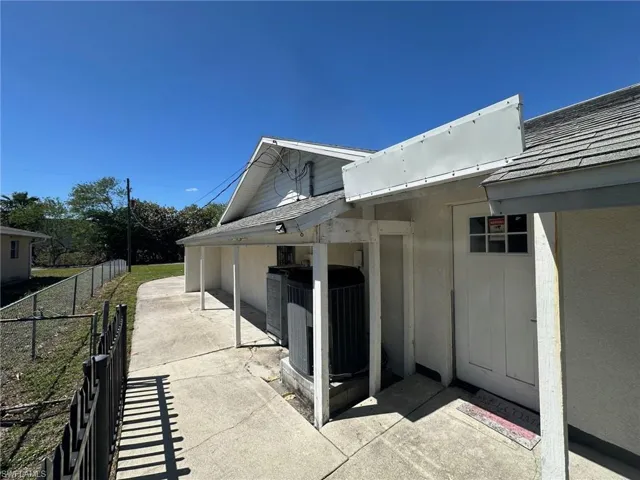 View of home's exterior with a shingled roof