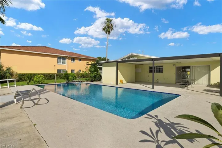 View of swimming pool with a patio area