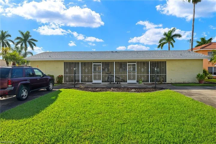 Single story home with a front yard