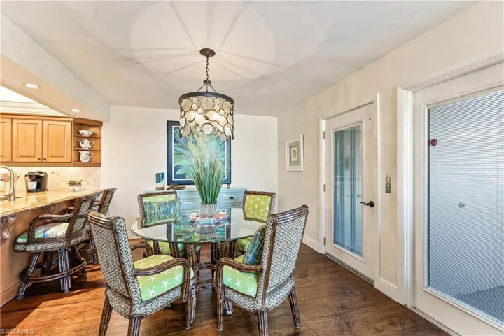 Dining room featuring wood flooring and a chandelier