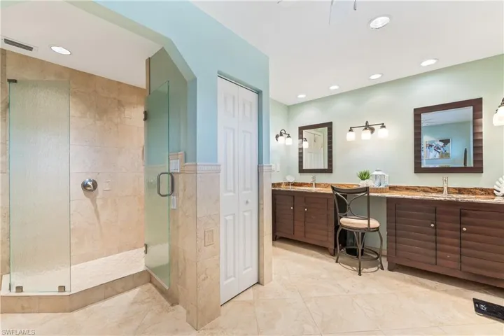 Bathroom featuring vanity and walk in shower
