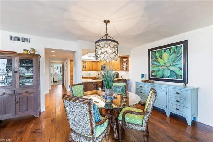 Dining room featuring a chandelier and wood floors