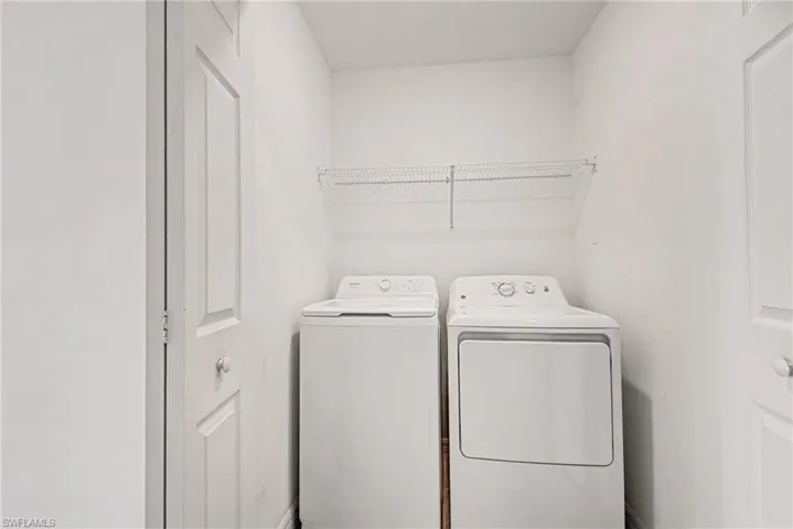 Laundry room with washing machine and clothes dryer