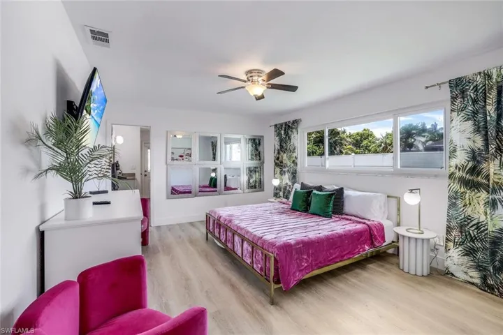 Bedroom featuring hardwood / wood-style floors and ceiling fan