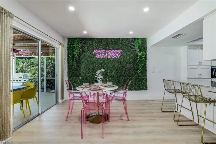 Dining area with light wood- flooring