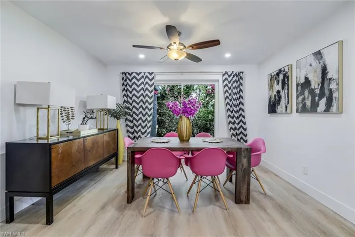 Dining space featuring ceiling fan and light wood-type flooring