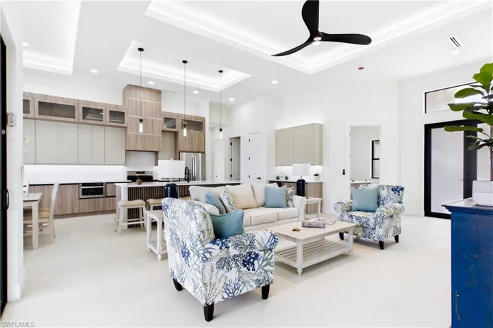 Kitchen featuring wood-finish cabinetry, stainless steel appliances, and a central island with pendant lighting