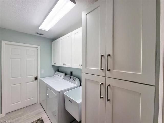 Upgraded Laundry Room w/Tub & Cabinetry