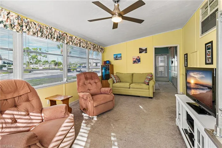Dining area featuring plenty of natural light, a paneled ceiling, and light tile patterned floors