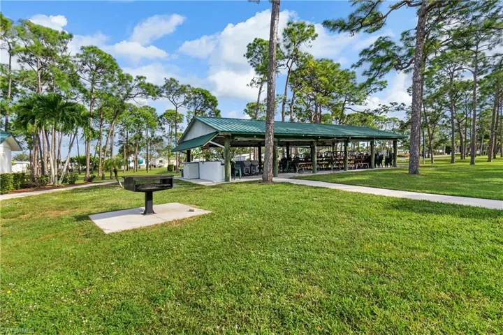 View of front of house with a sunroom and a front yard