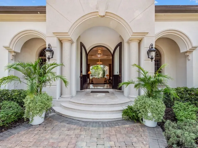 Raised grand entry foyer with solid wood & glass french doors