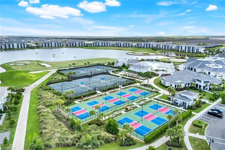 Aerial view of apartment complex and a nearby body of water