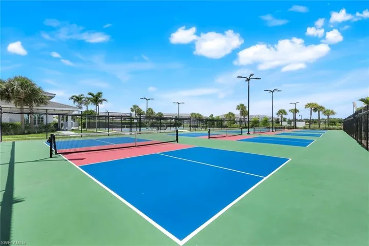View of tennis court with community basketball court