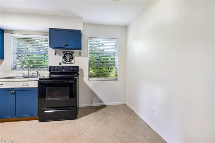 Upper and lower cabinetry with decorative hardware
