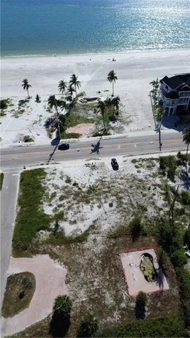 Aerial shot from over lot to beach.