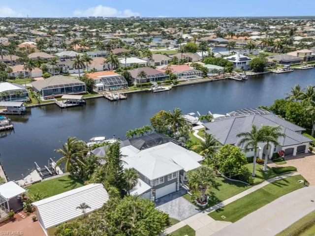 Aerial perspective of suburban area with a large body of water