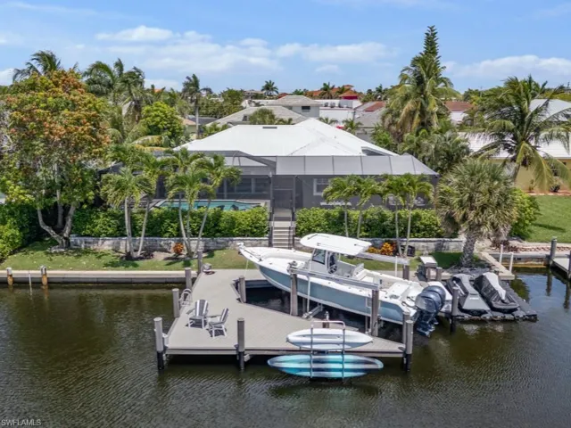 Dock featuring a water view and boat lift