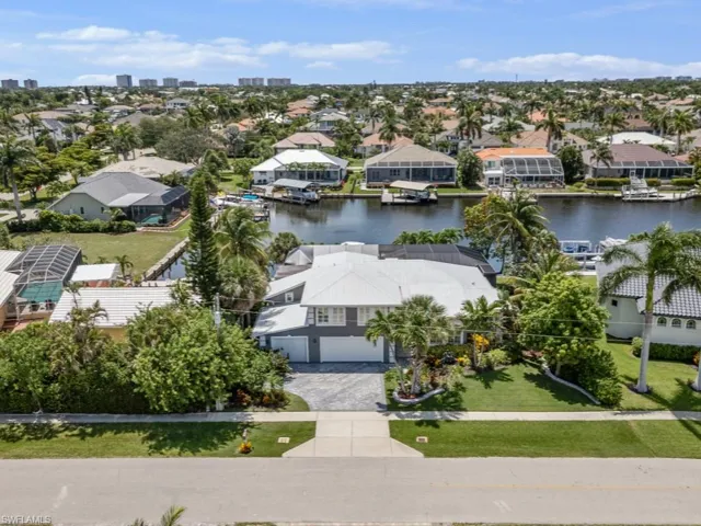 Aerial perspective of suburban area with a large body of water