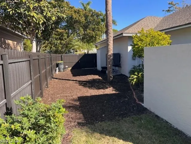 View of fenced backyard
