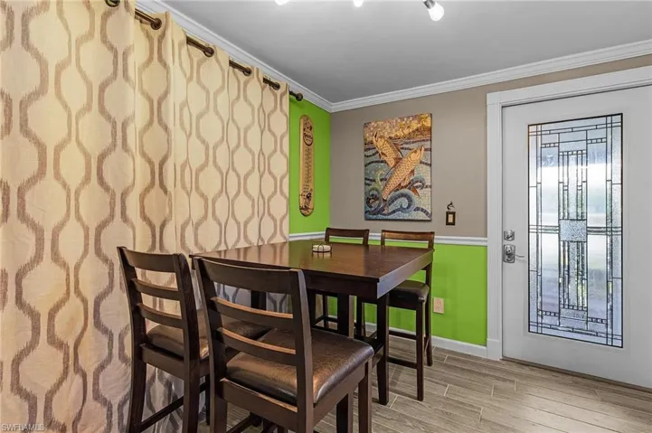 Dining with glass porch behind the curtains.