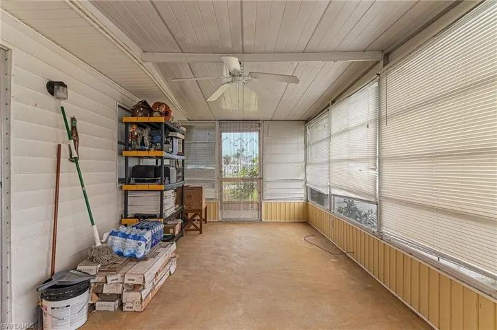 Sunroom.  Tile will remain and can be installed in the sunroom overlooking the canal.