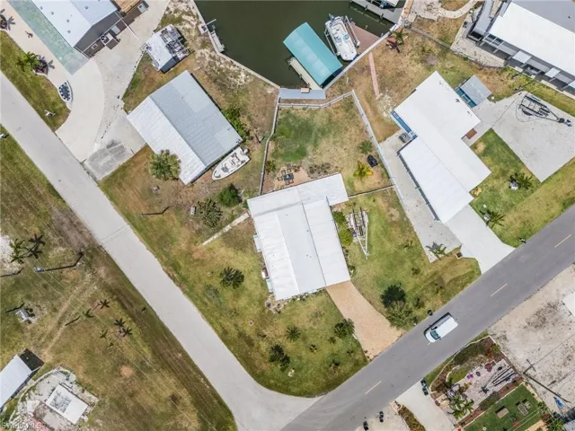 This is a large lot with plenty of room for a new pool and extra parking!