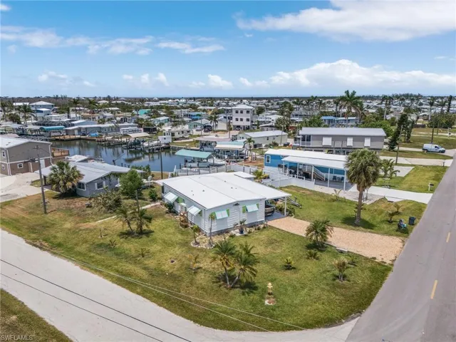 Aerial/Street View.  Plenty of parking area and room for a pool!