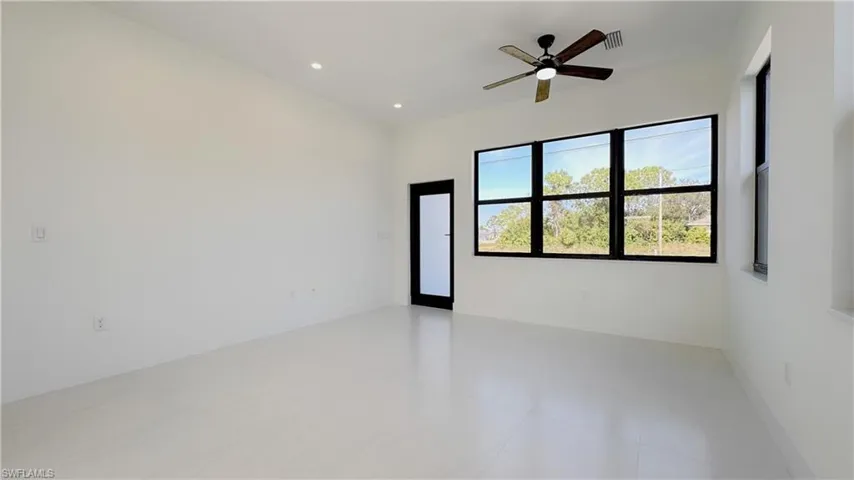 Tiled spare room featuring recessed lighting and ceiling fan