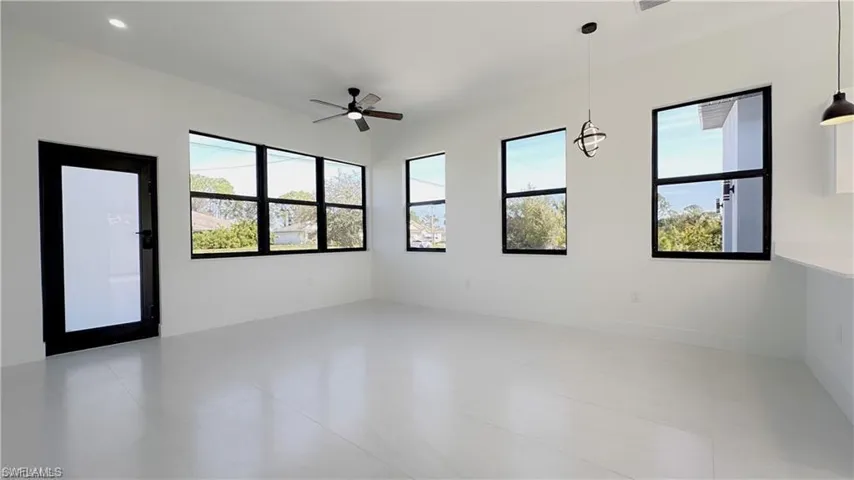 Spare room with ceiling fan