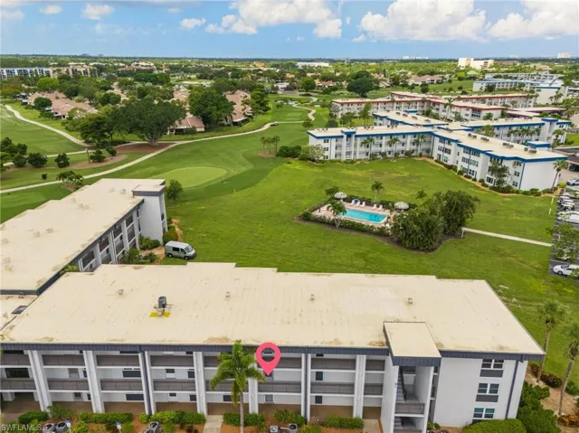 Aerial perspective highlighting multi-story residential buildings with surrounding green spaces