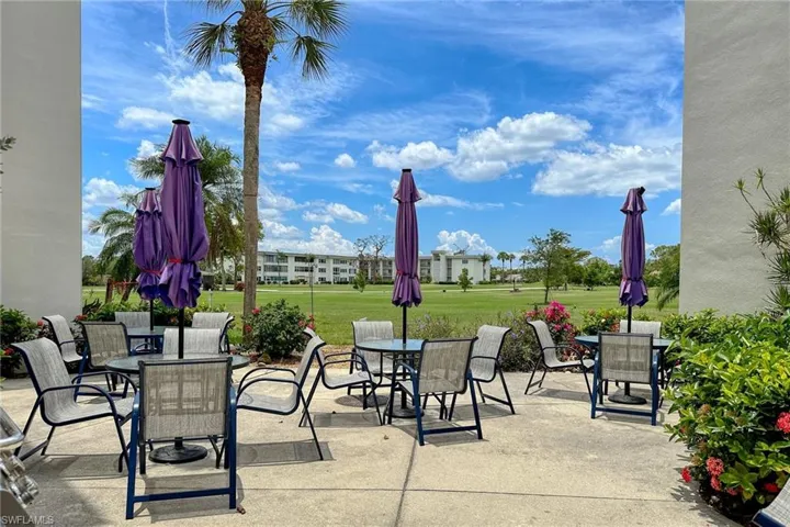 Expansive concrete patio area providing ample outdoor seating