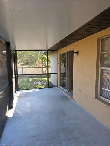 Unfurnished sunroom featuring plenty of natural light
