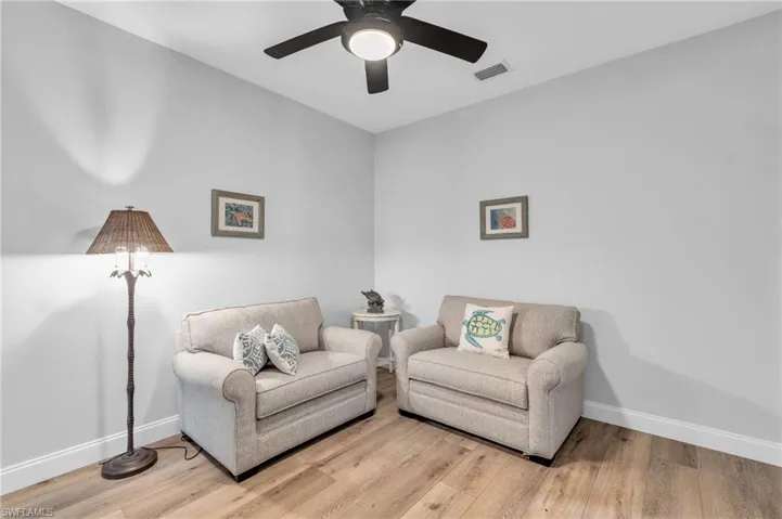 Mulit Gen Living Suite Sitting/ Den Sitting room featuring /wood-look  floors and ceiling fan