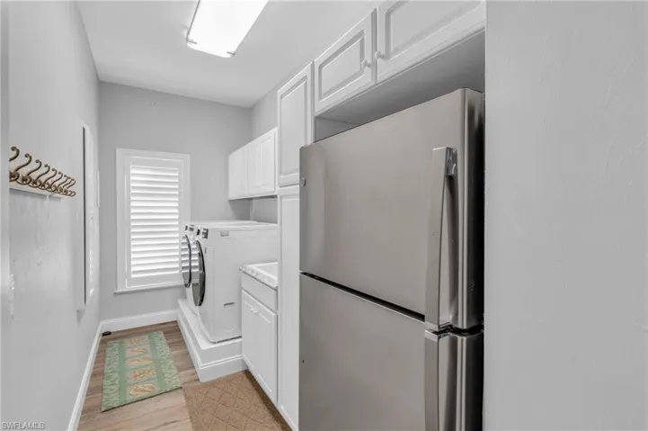 Utility Laundry with Built in cabinets, Deep Sink and Second  refrigerator