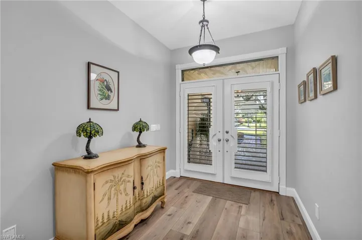 Entrance foyer with french doors and light wood-Look flooring