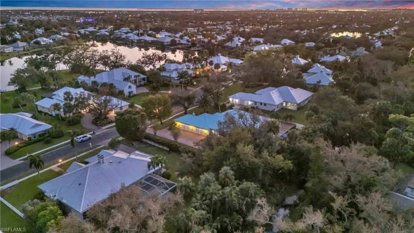 Aerial view at dusk of Side Drive and Garage
