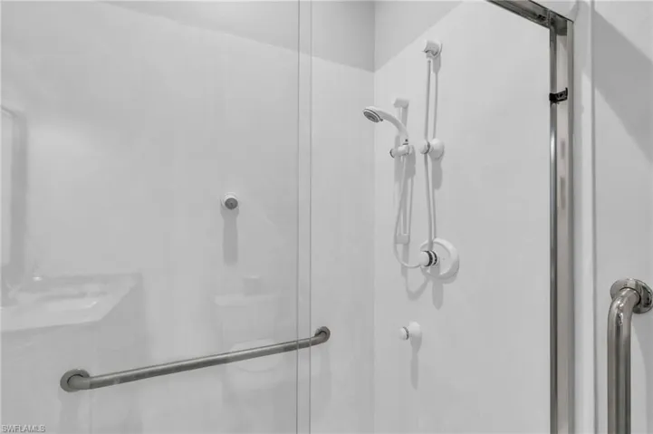 Multi Gen Suite Bathroom featuring walk in shower Multi shower heads