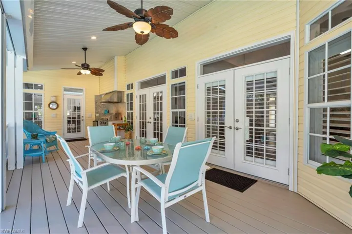 Rear deck & Eating area featuring french doors i and ceiling fan