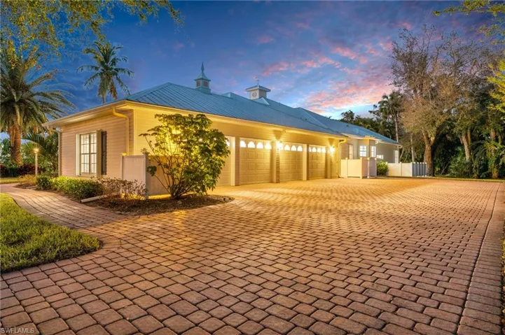 View of Side & 4 car Garage twilight