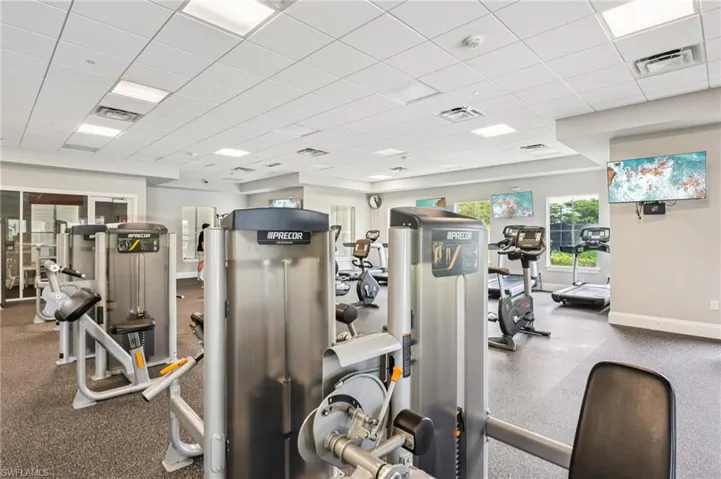 Workout area featuring a drop ceiling