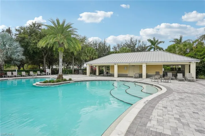Community pool with a patio area