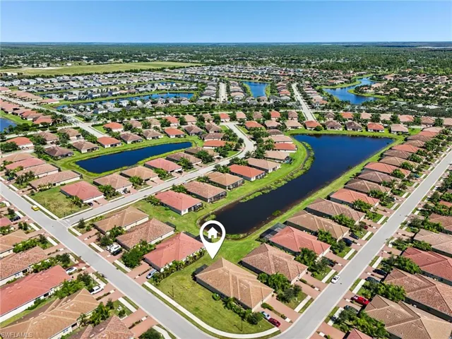 Aerial perspective of suburban area with a nearby body of water
